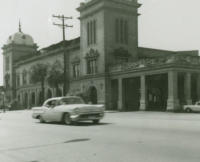 Auto Whizs Past Train