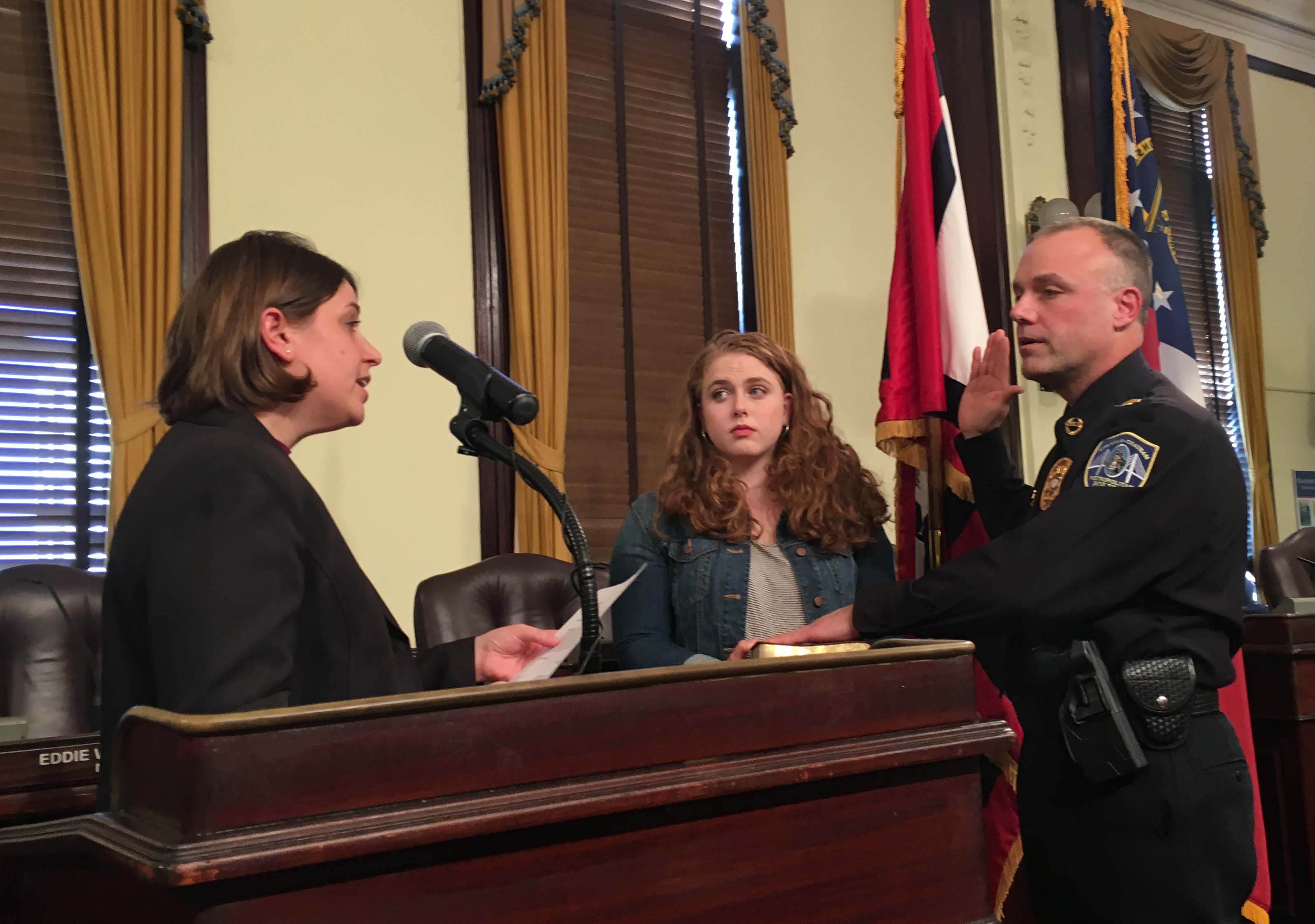 Revenew swearing in with Clerk and daughter